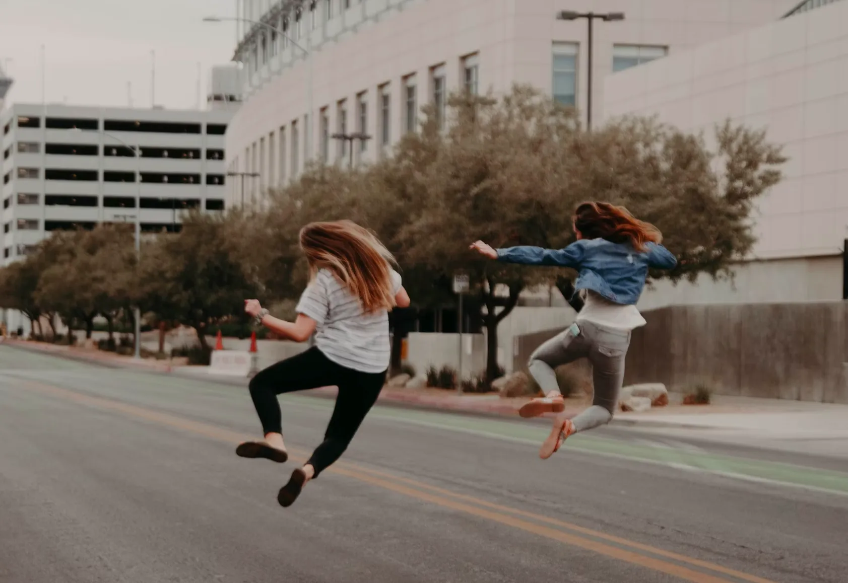 two people jumping with joy